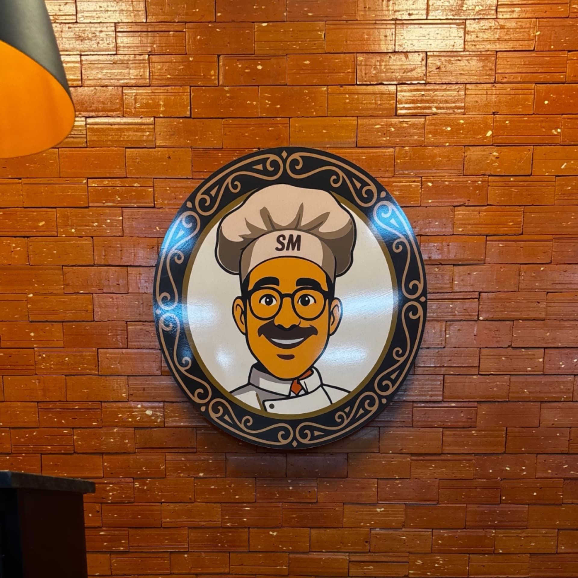 Logo da Padaria Super Mario na parede de tijolos